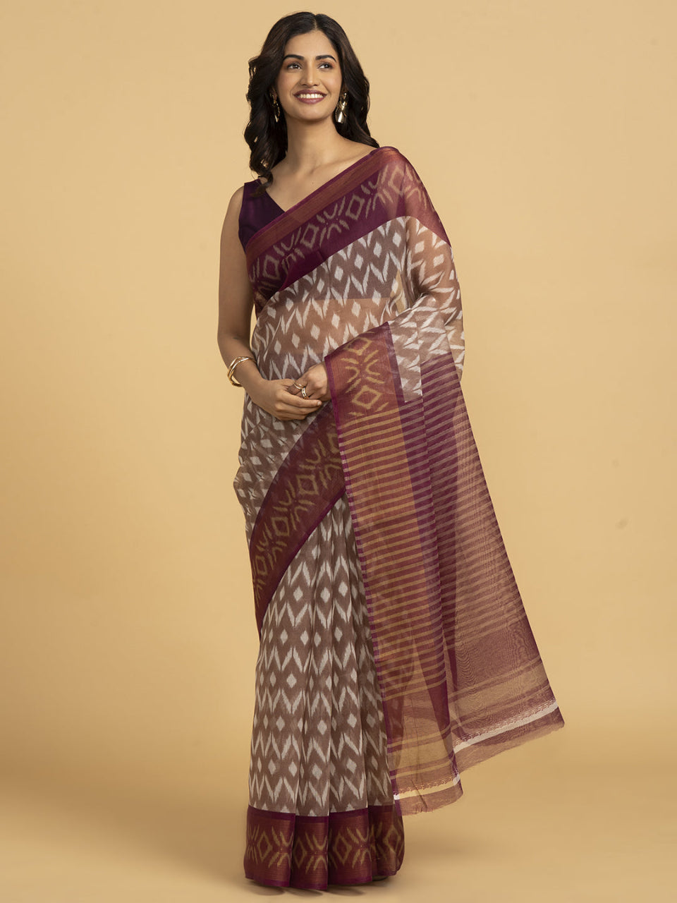 Divine Drapes Peach Ikat Design saree