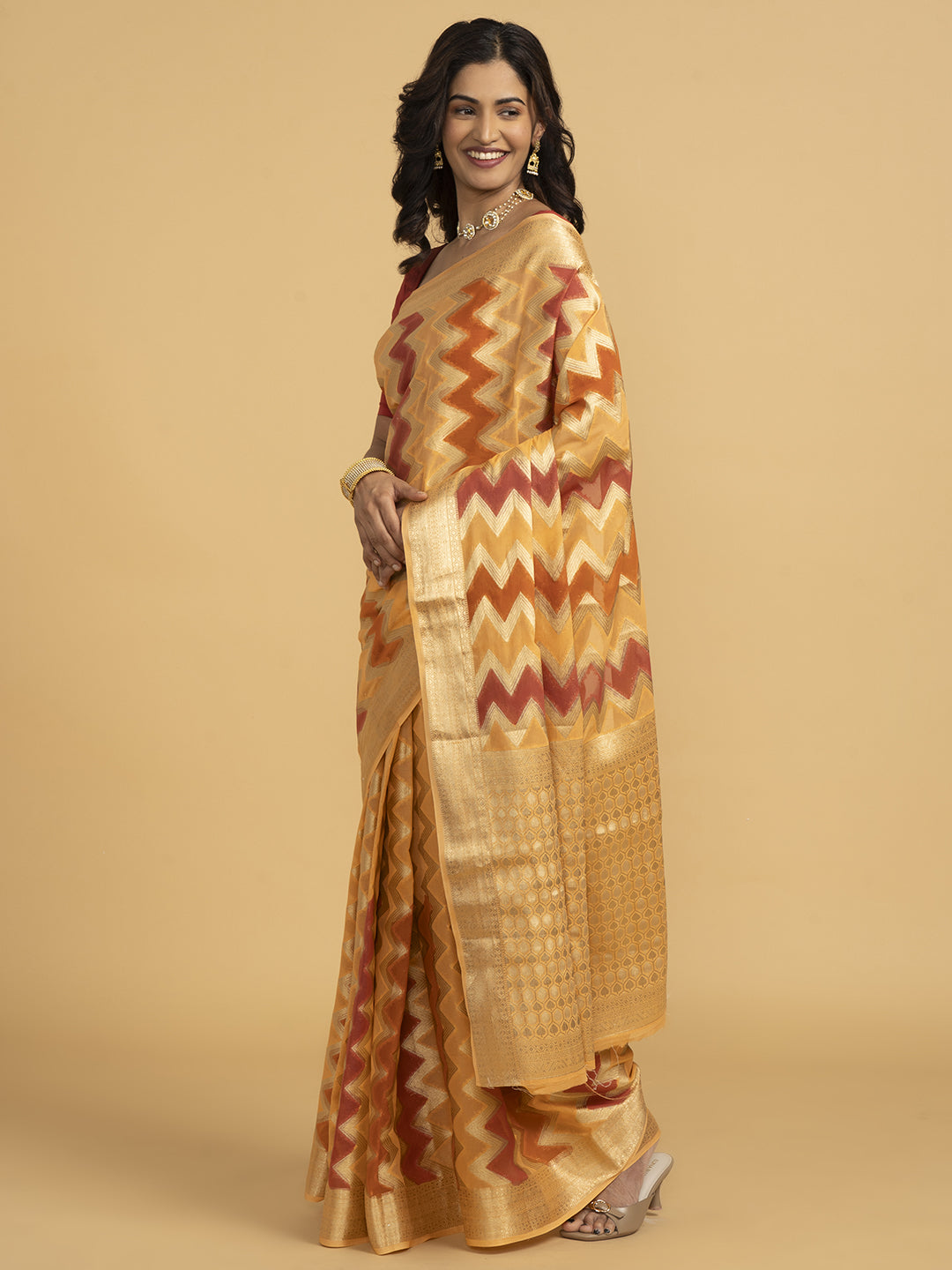 Divine Drapes Ikat Design Peach And Gold Saree