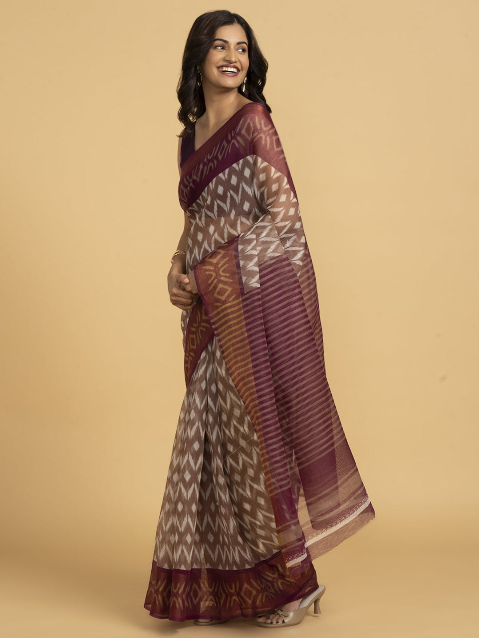 Divine Drapes Peach Ikat Design saree