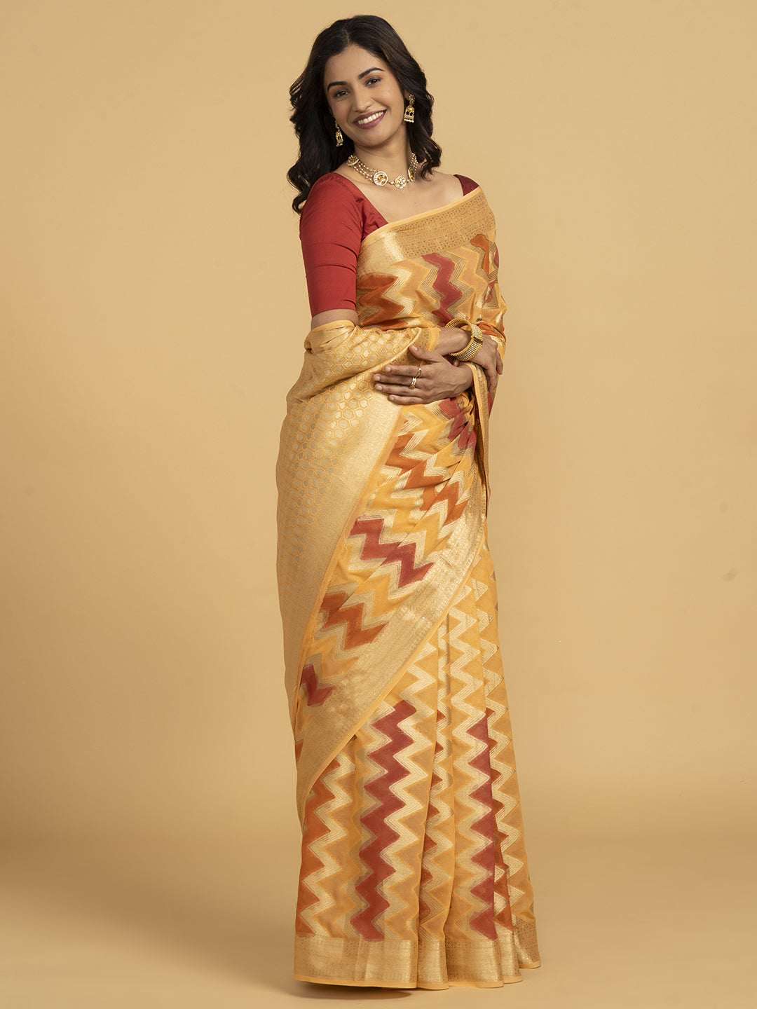 Divine Drapes Ikat Design Peach And Gold Saree