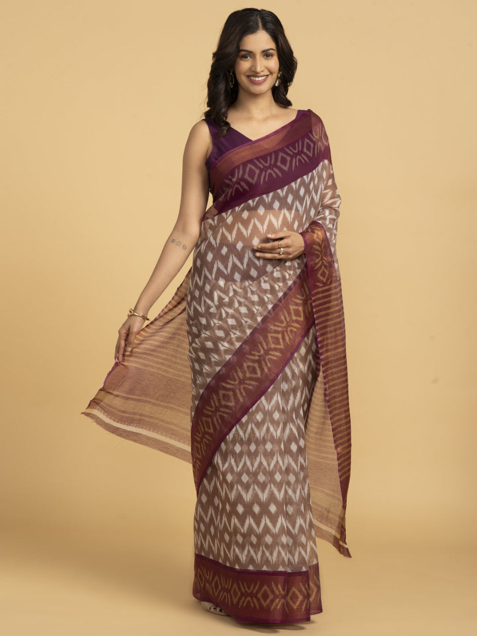 Divine Drapes Peach Ikat Design saree