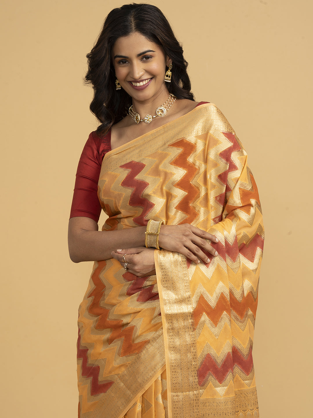 Divine Drapes Ikat Design Peach And Gold Saree