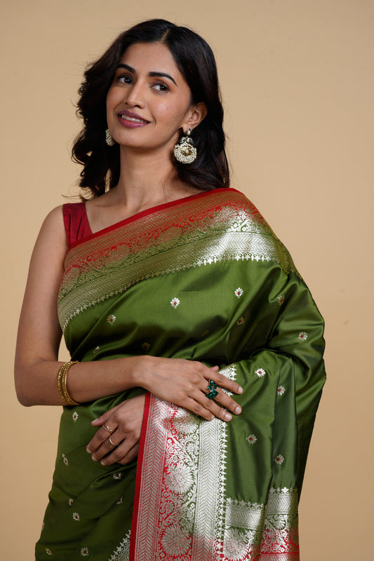 Divine Drapes Green Motif Saree With Red Boarder