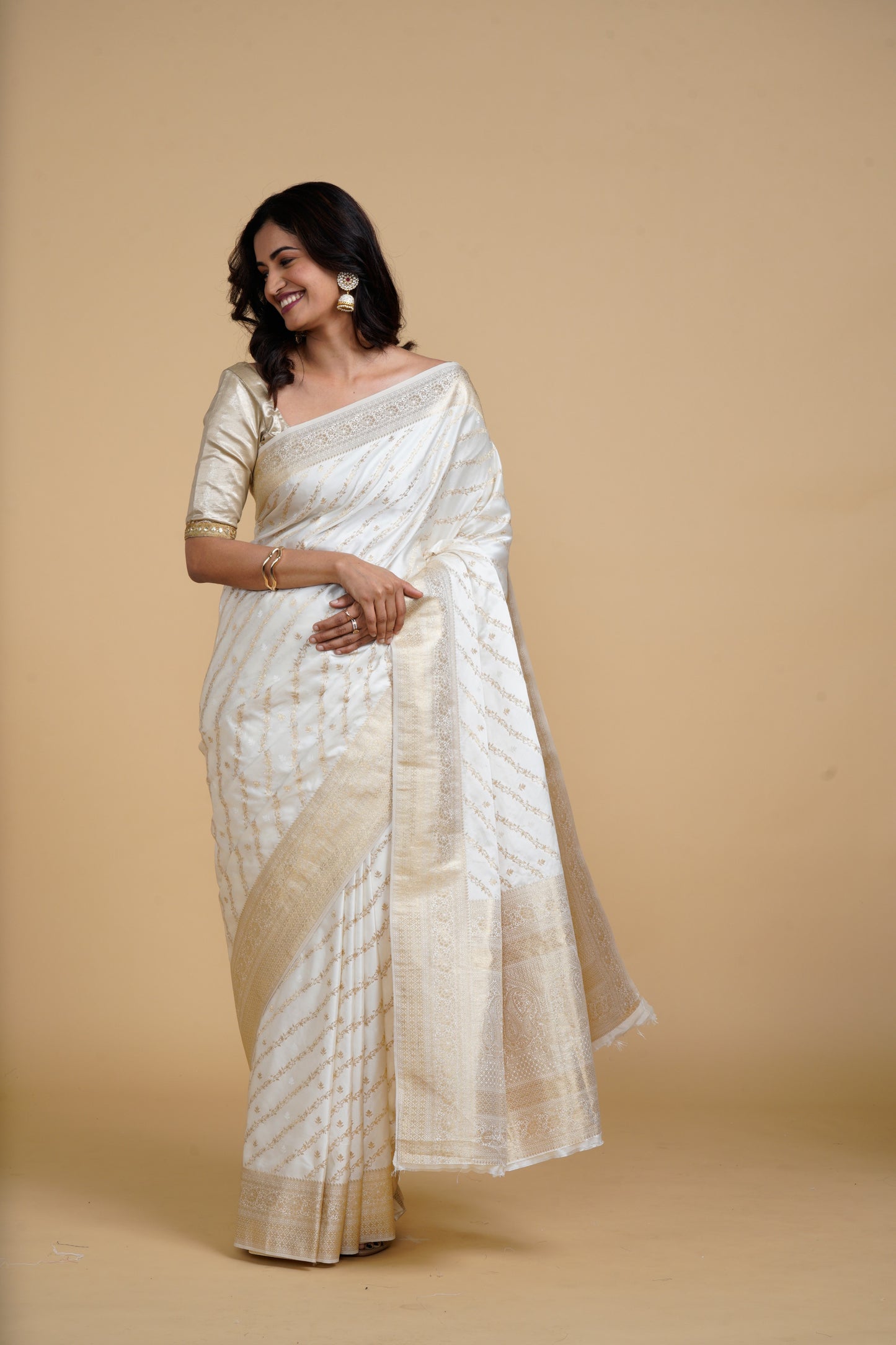 Divine Drapes White Golden Embellished Saree