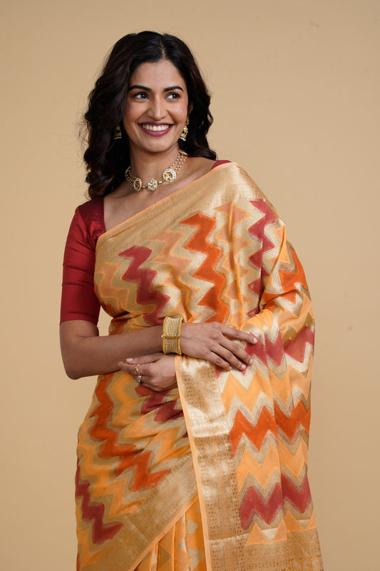 Divine Drapes Ikat Design Peach And Gold Saree