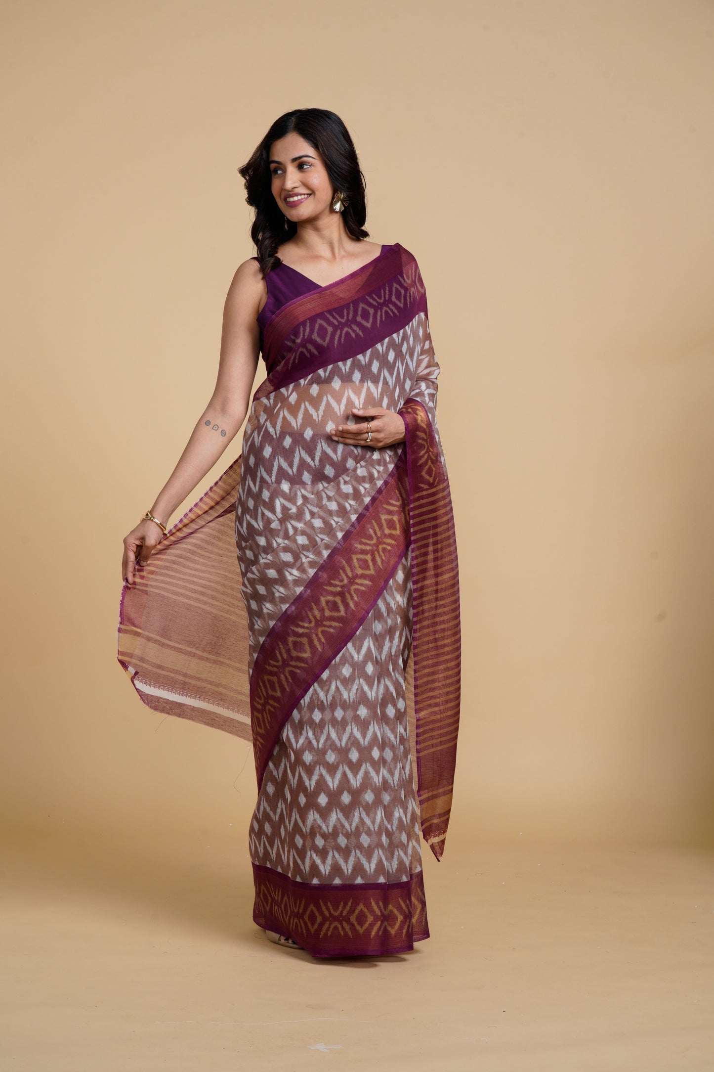 Divine Drapes Peach Ikat Design saree