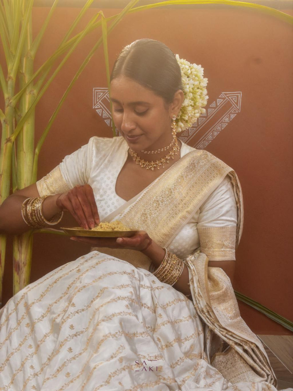 Divine Drapes White Golden Embellished Saree